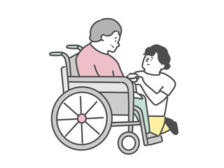 女性介護士と車椅子に乗った高齢女性