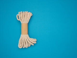 Wooden rope on a blue background.