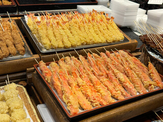 Fried shrimp on display at street food market 
