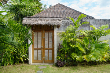 The entrance of a Balinese-style building seen from the courtyard