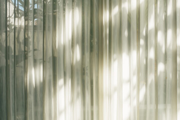 Light spots reflected on white curtain