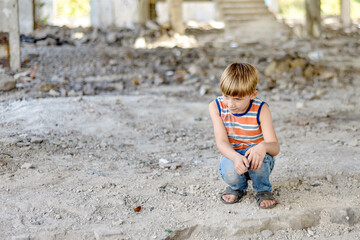 Poor and dirty street children living on an abandoned construction site.