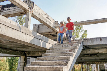 Poor and dirty street children living on an abandoned constructi