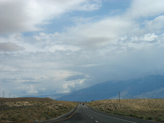 American road. Beautiful Pacific Northwest landscape with blue sky and white clouds. California...