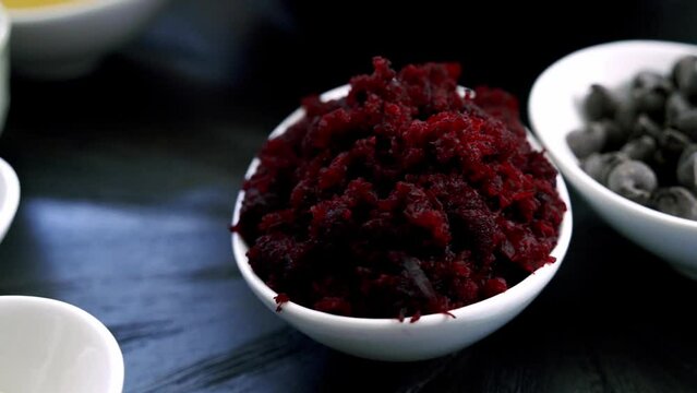 Slow motion circle shot of red beet pulp for a great recipe of chocolate beet pulp muffins