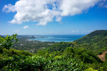 Captivating Panoramic View of Lombok's Coastal Landscape, Indonesia, Framed by Lush Greenery