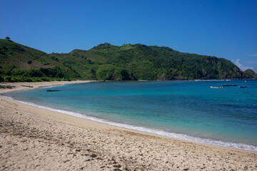 Pristine Mawun Beach in Lombok, Indonesia, Showcasing Unspoiled Sandy Shore and Crystal Clear Waters