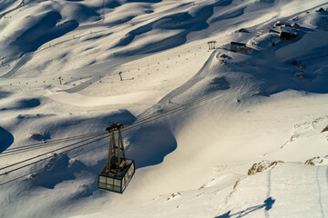 View to the Zugspitze glacier snow field during winter with the related cable car and background...
