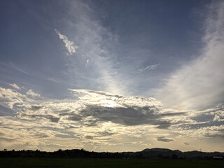 Beautiful view of clouds and sky in the afternoon with a hill