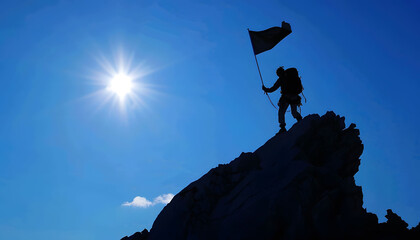 the silhouette of a climber on a mountain, represents goal achievement, target achieved, mission successful.