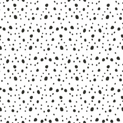 Ditsy seamless pattern with black dots on white background