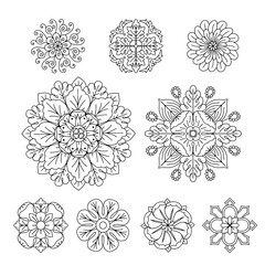 Hand drawn black linear classic floral rosette motifs set isolated on a white background