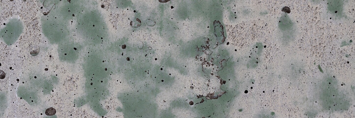 Vintage wall texture. Weathered stained rough surface of the concrete wall. A pattern with spots of...