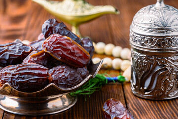 Dried delicious date fruit on wooden background	
