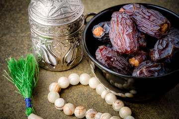 Dried delicious date fruit on vintage stone background	