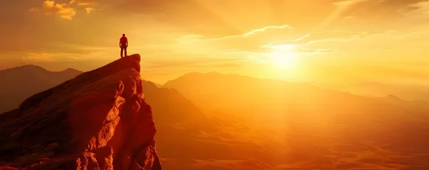 Tuinposter A solitary climber embraces the breathtaking mountaintop scenery during a sunset hike. Concept Hiking, Climbing, Sunset, Mountain Scenery, Solitude © Ян Заболотний