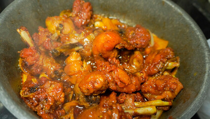 closeup of butter chicken cooking process, homemade recipe
