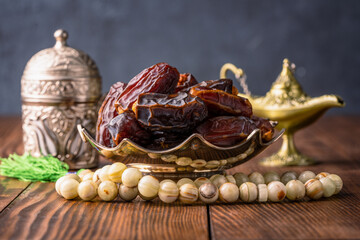 Dried delicious date fruit on wooden background	