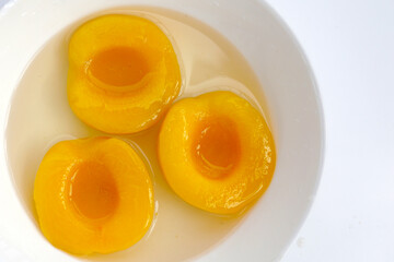 Peach halves in syrup. Fruity desserts