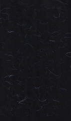Handmade rice black paper texture with blue fibers for scrapbook.