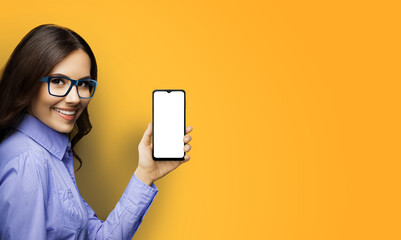 Portrait ad image of happy smiling young woman wear eye glasses hold show advertise smartphone cell...