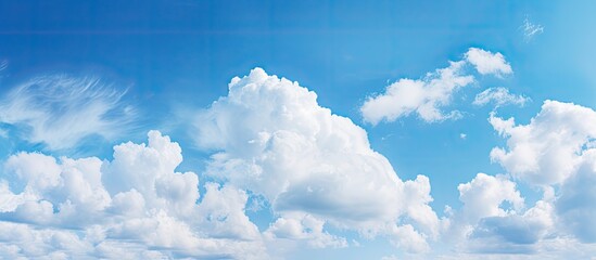Majestic Cumulus Cloud Soaring High in the Clear Blue Sky on a Sunny Day - obrazy, fototapety, plakaty