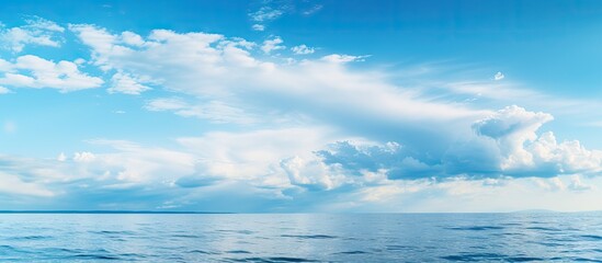 Obraz premium Vibrant Blue Sky with Puffy Clouds, Inspiring Peace and Serenity in Nature