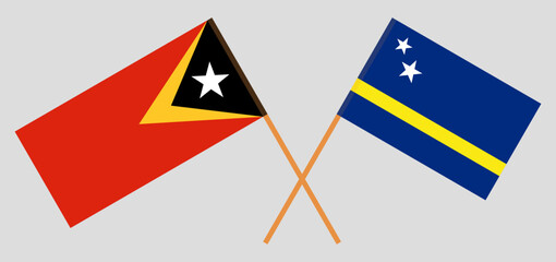 Crossed flags of East Timor and Country of Curacao. Official colors. Correct proportion