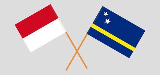 Crossed flags of Monaco and Country of Curacao. Official colors. Correct proportion