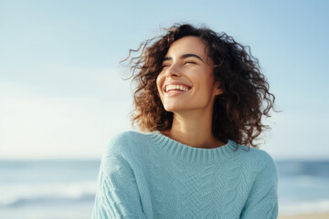 Joyful woman enjoying sunshine on sandy beach. Emotional wellbeing and relaxation.