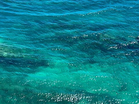 Blue glittering ocean water aerial view.