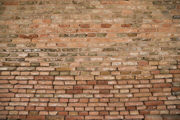 Fototapeta premium Panoramic background with wide texture of antique red brick wall. Design background for home or office.