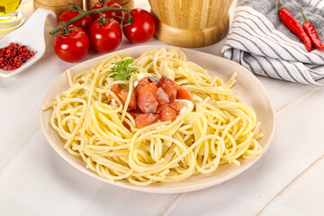 Pasta spaghetti with salmon and stracciatella