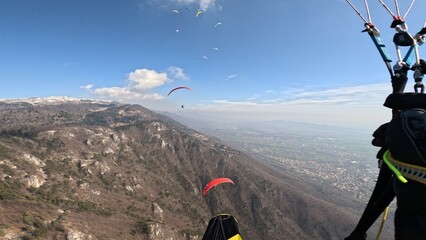 paragliding in the mountains. Thermal flight in Bassano, Italy