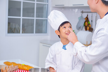 father and son cooking