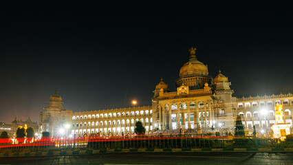 Fototapeta na wymiar Night view of Vidhana Soudha, a building in Bangalore, India which serves as the seat of the state legislature of Karnataka, India. 