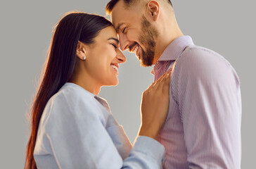 Happy people in love, man and woman standing close laughing in intimate romantic Valentine day emotion. Loving couple showing affection, male, female pair expression of romance, celebrating holiday 