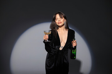 beautiful fashion elegant woman model in a fashionable black sexy evening dress with a neckline...