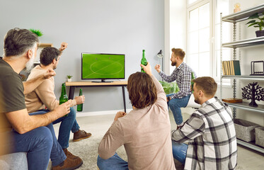 Friends football fans watching soccer sport match together. Male friends cheering for their...