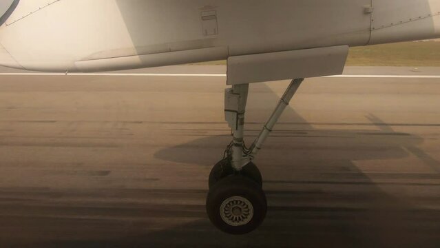 Passenger POV of the retraction of the landing gear on a small aircraft
