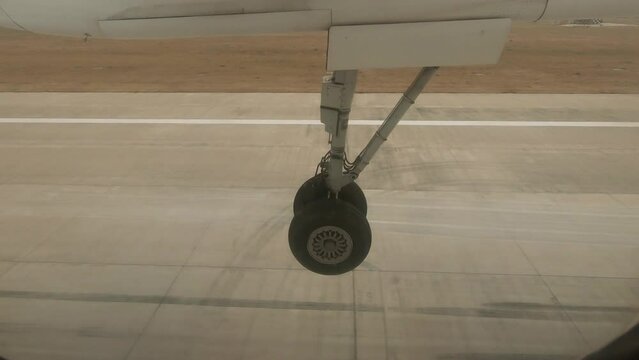 ATR landing gear comes in contact with the tarmac during landing