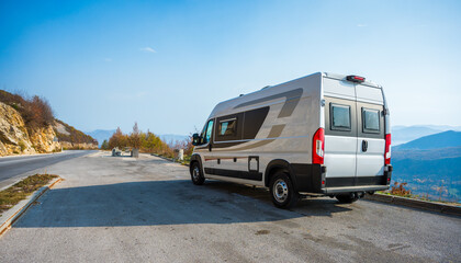 Campervan, Motorhome RV parked on the side of the road in Bosnia and Herzegovina. Travelers with...