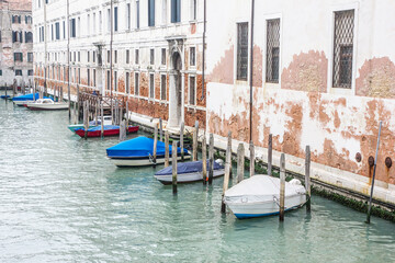 Venice canal landscape. Boats parked. Parking of private boats. Transportation background. Motorboat in Italy.