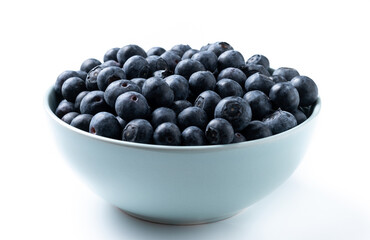 Blueberries in green bowl isolated on white background
