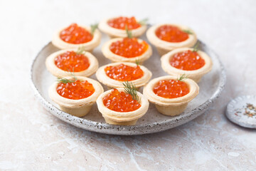 Red caviar served in tartlets