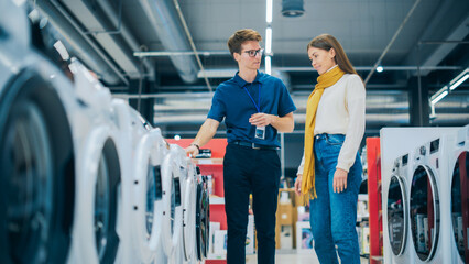 Customer Engages in Dialogue with a Retail Electronics Shop Consultant while Choosing a Washing...
