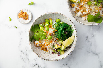 Healthy vegan poke with edamame beans and seaweed
