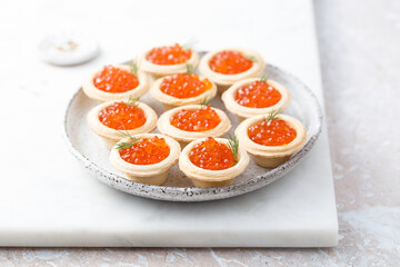 Red caviar served in tartlets - obrazy, fototapety, plakaty