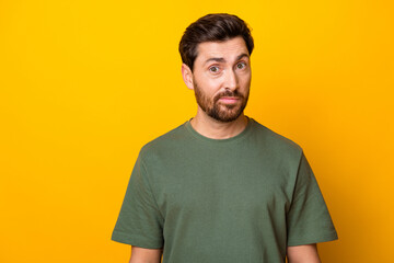 Obraz premium Photo of positive good mood guy dressed green t-shirt smiling empty space isolated yellow color background