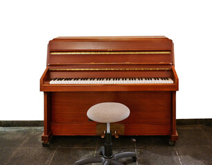 Fototapeta na wymiar Old upright piano and a stool and three blank frames against Glitter wall.